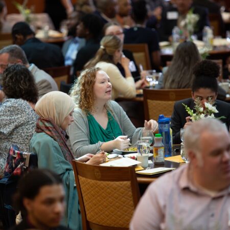 a group of people sitting at tables