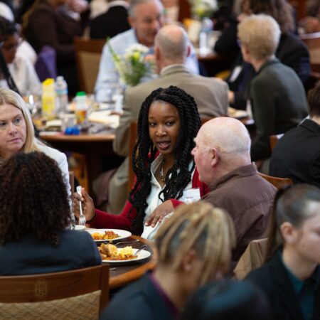 a group of people sitting at tables