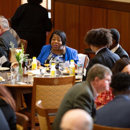 a group of people sitting around a table