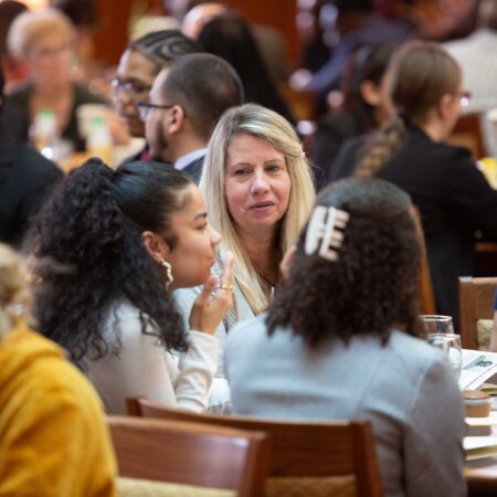 a group of people sitting at tables