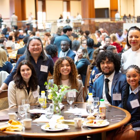 a group of people sitting at a table
