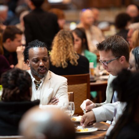 a group of people sitting at tables