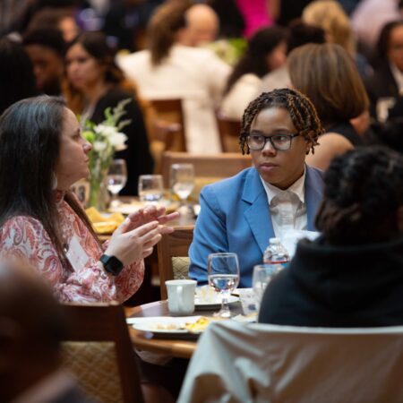 a group of people sitting at tables