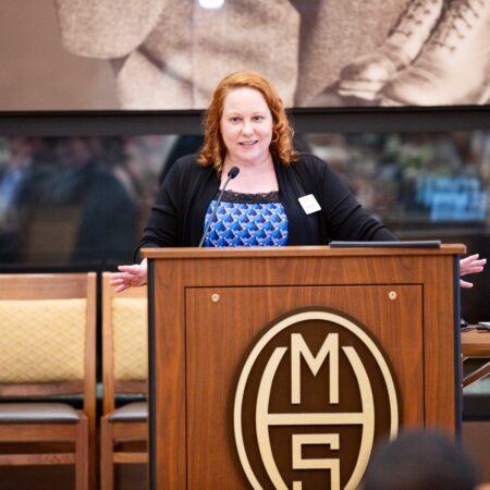 a person standing at a podium
