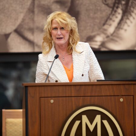a person standing at a podium