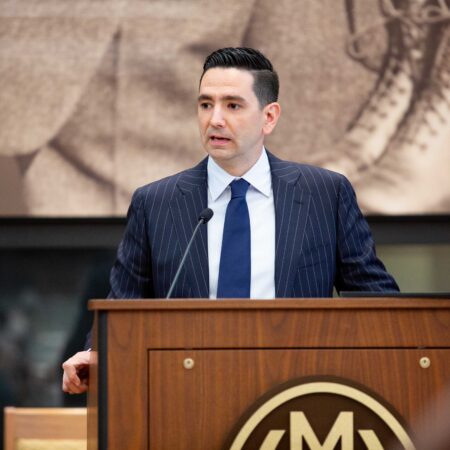 a person standing at a podium
