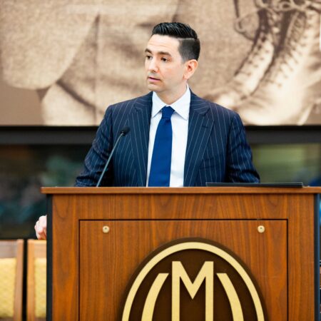 a person standing at a podium