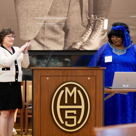a person giving a speech at a podium