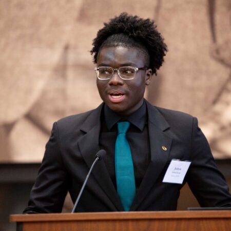 a person standing at a podium