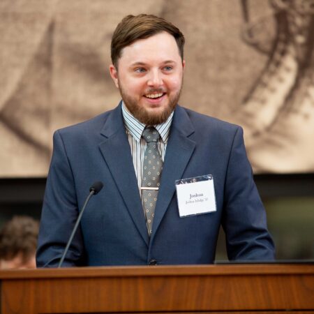 a person standing at a podium