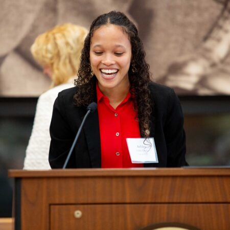 a person standing at a podium
