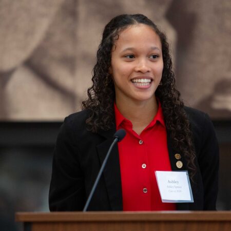 a person standing at a podium