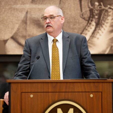 a person standing at a podium