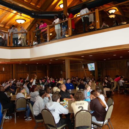 a group of people sitting in chairs in a room