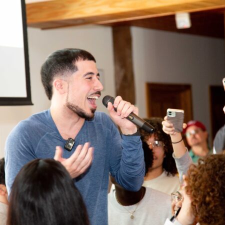 a person singing into a microphone