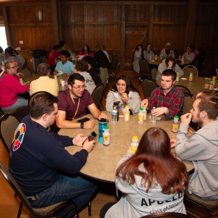 a group of people sitting around a table