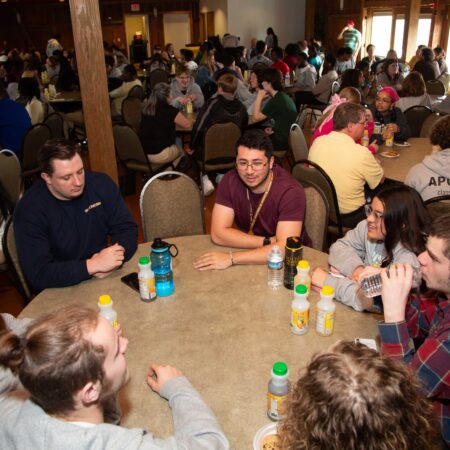 a group of people sitting around a table