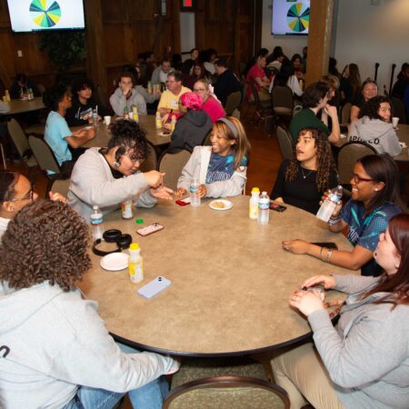 a group of people sitting around a table