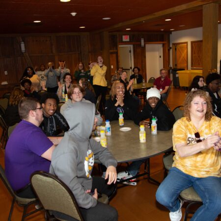 a group of people sitting around a table