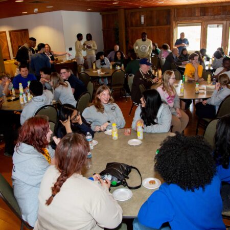 a group of people sitting at tables