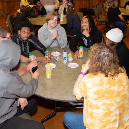 a group of people sitting around a table