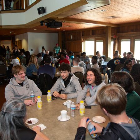 a group of people sitting around a table