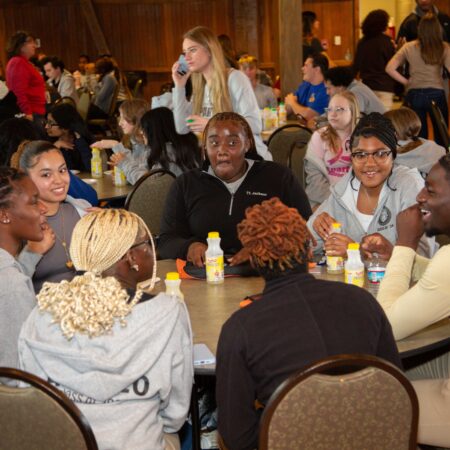 a group of people sitting around a table