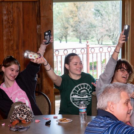a group of people sitting at a table