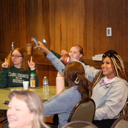 a group of people sitting at a table