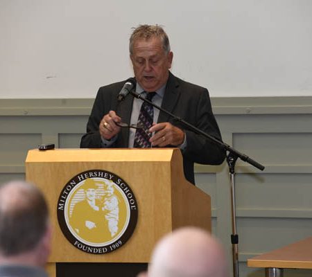 a person speaking at a podium