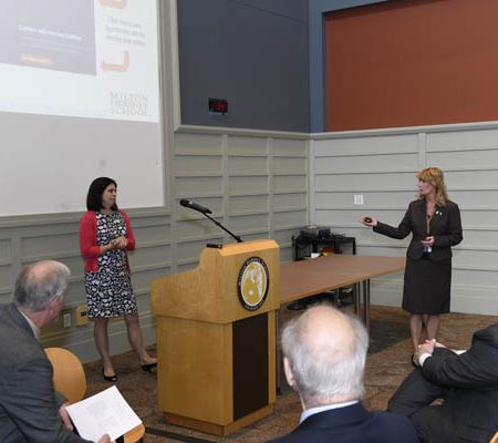a person giving a presentation to a group of people
