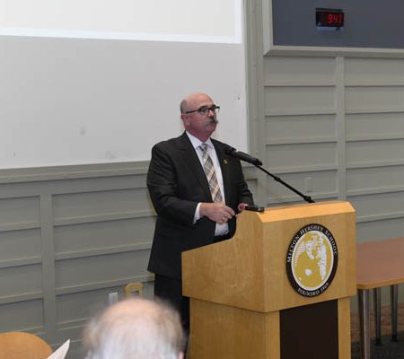 a person standing at a podium