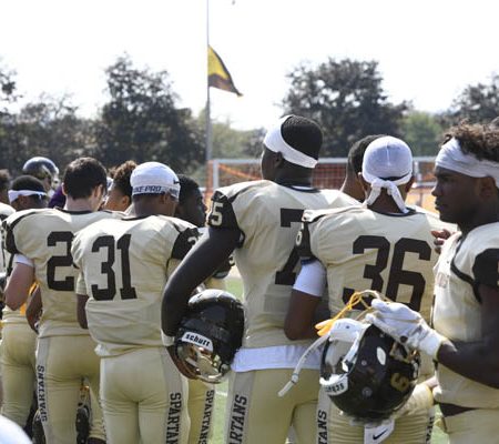 a group of football players standing together