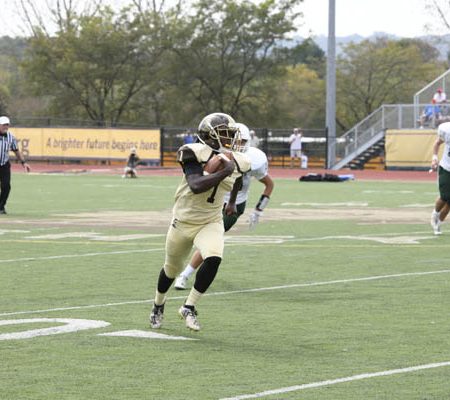 a football player running on a field