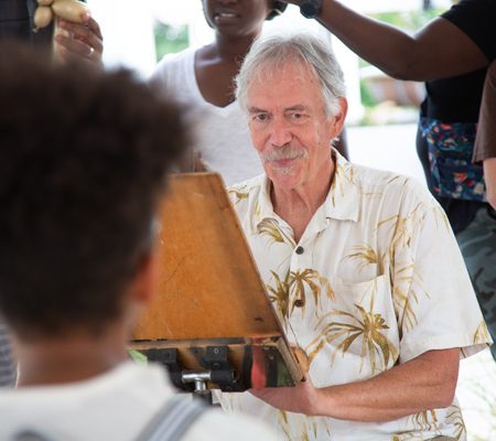 a person holding an easel