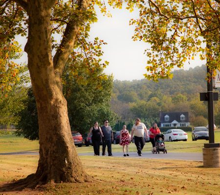 a group of people walking on a road
