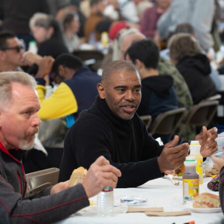 a group of men sitting at tables