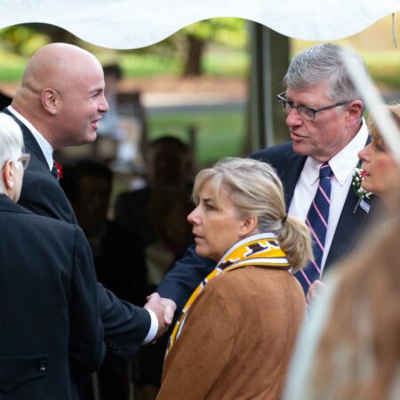 a person shaking hands with a person