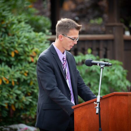 a person standing at a podium