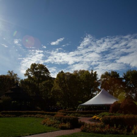 a white tent in a park