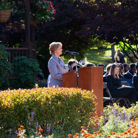 a person standing at a podium