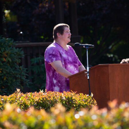a person standing at a podium