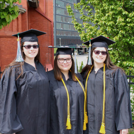a group of women in graduation gowns