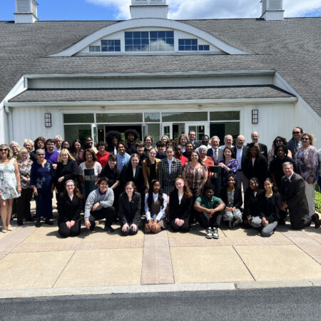 MHS students and alumni pose for a photo after the Alumni-Student Awards Luncheon